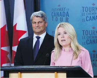  ?? SEAN KILPATRICK /THE CANADIAN PRESS ?? Michelle Rempel, Conservati­ve immigratio­n critic, and Gerard Deltell, Conservati­ve treasury board critic, unveil their party’s immigratio­n platform in Ottawa on Wednesday.