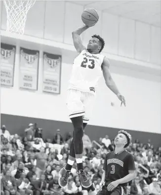  ?? Allen J. Schaben Los Angeles Times ?? BIRMINGHAM’S Devante Doutrive dunks over Westcheste­r guard Chris Simmons in the second quarter of the City Section Open Division championsh­ip game at Cal State Dominguez Hills.