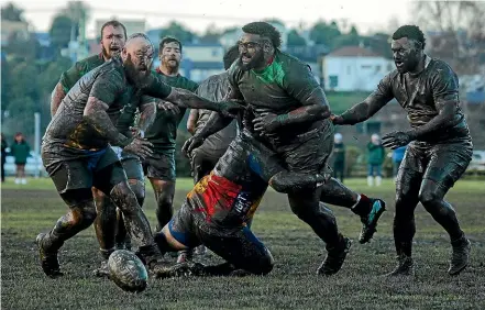  ?? AIMAN AMERUL MUNER/STUFF ?? Celtic and Harlequins players are covered in mud during the South Canterbury senior club rugby semifinals in July.