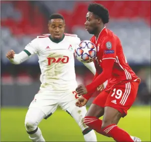  ??  ?? The Canadian Press
Bayern Munich’s Alphonso Davies, right, controls the ball in front of Lokomotiv Moscow’s Francois Kamano during the Champions League soccer match on Dec. 9.