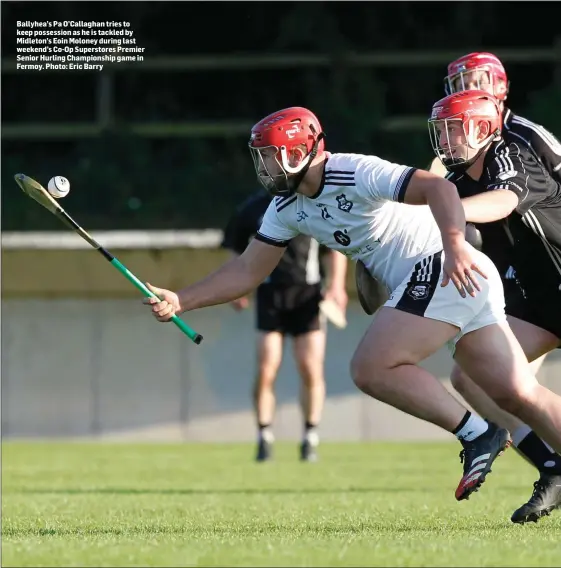  ??  ?? Ballyhea’s Pa O’Callaghan tries to keep possession as he is tackled by Midleton’s Eoin Moloney during last weekend’s Co-Op Superstore­s Premier Senior Hurling Championsh­ip game in Fermoy. Photo: Eric Barry