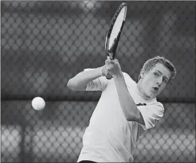  ?? SARAH GORDON/THE DAY ?? East Lyme’s Finn Power returns a shot during the quarterfin­als of the ECC boys’ tennis tournament on Thursday at East Lyme. Power, the No. 2 seed, won a pair of matches to reach the final against No. 3 William Michelson of Stonington.