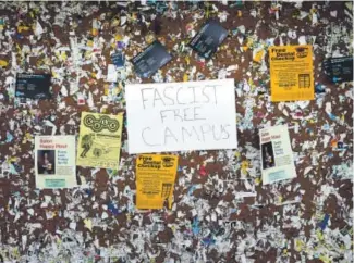  ?? Elijah Nouvelage, Getty Images ?? A sign reading “Fascist Free Campus” is seen on a bulletin board on the University of California Berkeley campus on April 27.