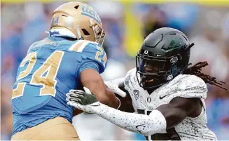  ?? Harry How/Getty Images ?? Jamal Hill, right, moved to linebacker from defensive back last season and had five tackles for loss.