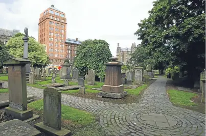  ?? Picture: Dougie Nicolson. ?? The stone is the oldest monument discovered at the Howff in Dundee.