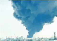  ?? — AFP photo ?? Smoke is seen rising from the Interconti­nentalTerm­inals Company (ITC) plant in the suburb of Deer Park in Houston,Texas.