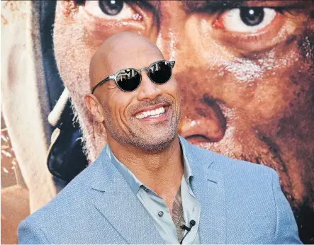  ?? THE ASSOCIATED PRESS ?? Dwayne Johnson’s father, Rocky, is an African Nova Scotian pro wrestler, whose life story may be coming to the big screen.