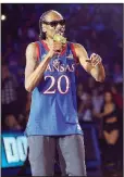  ?? AP/NICK KRUG ?? Rapper Snoop Dogg performs during Late Night in the Phog, Kansas’ annual basketball kickoff at Allen Fieldhouse in Lawrence, Kan. Kansas Athletic Director Jeff Long apologized for Snoop Dogg’s act, which featured stripper poles, dancers and profanity.
