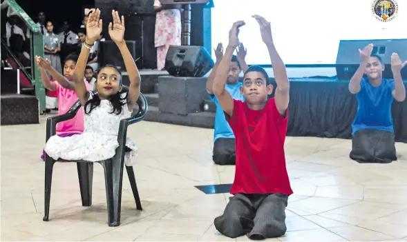  ?? Photo: Christian Mission Fellowship Internatio­nal ?? Students of Hilton Special School take part in a worship dance during their joint Easter Service with Christian Mission Fellowship Primary and Secondary School yesterday.