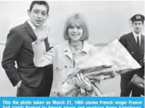  ??  ?? This file photo taken on March 21, 1965 shows French singer France Gall (right) flanked by French singer and musician Serge Gainsbourg, greeting the public upon her arrival at the Orly airport outside Paris.