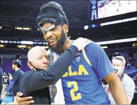  ?? Tim Nwachukwu Getty Images ?? UCLA coach Mick Cronin celebrates a win over Michigan with Cody Riley. Says one former UCLA player from the 1970s: “I love Mick Cronin. He is fantastic.”