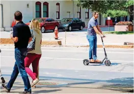  ?? [PHOTO BY DOUG HOKE, THE OKLAHOMAN] ?? A Bird scooter got a workout shortly after the company arrived in Oklahoma City last summer.