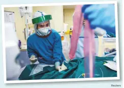  ?? Reuters ?? A medical specialist works in the ICU of the City Clinical Hospital Number 52, where people suffering from Covid-19 are treated in Moscow, Russia, on Thursday.