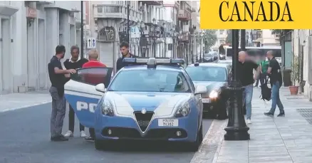  ?? POLIZIA DI STATO ?? Police take a suspect into custody Friday in an anti-mafia probe in Italy that was conducted in co-ordination with York Regional Police in Ontario.