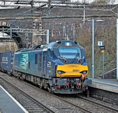  ?? NIGEL CAPELLE. ?? DRS 88001 heads south through Hartford, Cheshire, with an intermodal service on January 8 2019. In the absence of the Golborne Link or a suitable alternativ­e, HS2 services will be forced to re-join the West Coast Main Line at Crewe and use this congested two-track section to Weaver Junction and beyond.