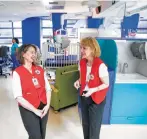  ??  ?? Baycroft, left, shares a laugh with fellow baby rocker Jacqueline Clote at Texas Children’s Hospital.