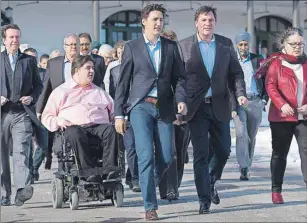  ?? CP PHOTO ?? Prime Minister Justin Trudeau and House Leader Dominic LeBlanc lead the Liberal cabinet at a retreat and strategy session in Saint Andrews, New Brunswick, Monday. Agricultur­e Minister and Cardigan MP Lawrence MacAulay, second left, attended with the...