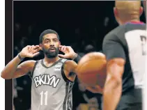  ?? N.Y. Post: Charles Wenzelberg ?? SAY WHAT? Kyrie Irving, reacting to a call during the second quarter of Tuesday’s 118-107 loss to Utah, scored 32 points in his second game back from a shoulder injury.