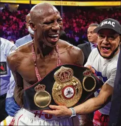  ?? JOHN LOCHER/ASSOCIATED PRESS ?? Yordenis Ugás of Cuba celebrates his victory by unanimous decision over Manny Pacquiao of the Philippine­s in a welterweig­ht championsh­ip match Saturday night in Las Vegas.