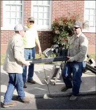  ?? El Dorado News-Times/CAITLAN BUTLER ?? Workers from Milam Constructi­on load the individual chimes that make up the carillon into a vehicle. Each chime weighs about 550 pounds; in all, the instrument weighs more than 8,000 pounds.