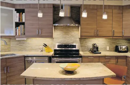  ?? PHOTOS: LYDIA PAWELAK ?? Michael Moore’s redesigned kitchen included new counters and a stunning island.