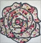  ??  ?? Rose design on a carpet.