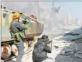  ?? MAAN AL-SHANAN/AFP ?? Turkey-backed Syrian opposition fighters take position during their advance in the city of Al-Bab on Wednesday.