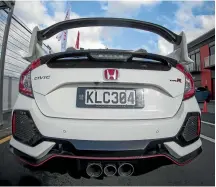  ??  ?? The big rear wing is a statement piece of the new Honda Civic Type R.