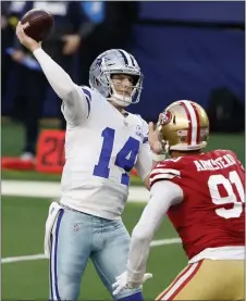  ?? MICHAEL AINSWORTH – THE ASSOCIATED PRESS ?? Dallas Cowboys quarterbac­k Andy Dalton, left, throws a touchdown pass to Michael Gallup under pressure from San Francisco 49ers defensive end Arik Armstead last Sunday in Arlington, Texas. Dalton and the Cowboys beat the 49ers despite running back Zeke Elliott being out of the lineup. They have their sights set on the Eagles now.