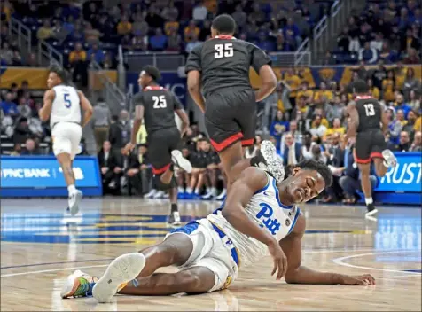  ?? Matt Freed/Post-Gazette photos ?? Xavier Johnson collects himself after committing a turnover Saturday against Nicholls State at Petersen Events Center.