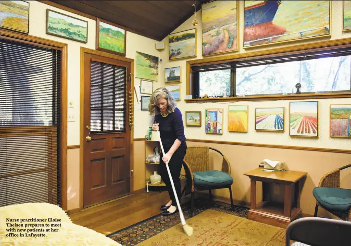  ?? Michael Short / Special to The Chronicle ?? Nurse practition­er Eloise Theisen prepares to meet with new patients at her office in Lafayette.