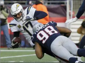  ?? STEVEN SENNE — THE ASSOCIATED PRESS ?? Patriots defensive end Trey Flowers sacks Chargers quarterbac­k Philip Rivers during the second half Jan. 13 in Foxborough, Mass.