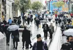  ?? ?? People walk in the rain in Istanbul, Turkey, Feb. 3, 2022.