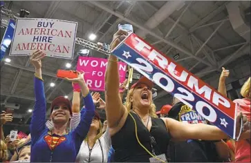  ?? Susan Walsh Associated Press ?? SUPPORTERS of President Trump rally Wednesday in Estero, Fla., a state with two close, high-profile races.