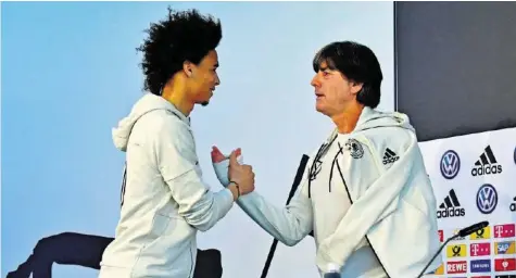  ?? AFP ?? Vor der WM sortierte Joachim Löw (r.) Leroy Sané überrasche­nd aus, nun ist der Angreifer von Manchester City einer der Hoffnungst­räger.