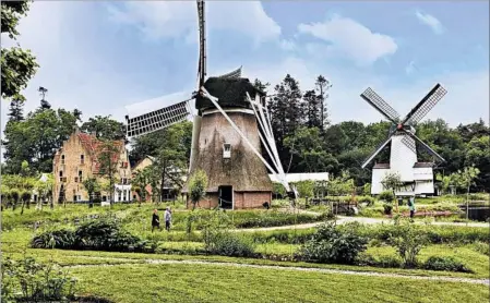  ?? SANDRA HUNDACKER/RICK STEVES’ EUROPE ?? From historic buildings to elegant windmills to live folk music, the Netherland­s Open Air Museum in Oslo is a one-stop look at traditiona­l Dutch culture.