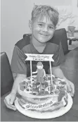  ?? BOUTTE FAMILY ?? Carson Boutte, 9, of Youngsvill­e, La., didn’t ask for a birthday cake, but baker Sarah Trosclair made him one that looked like a pizza in honor of his desire to help flood victims.