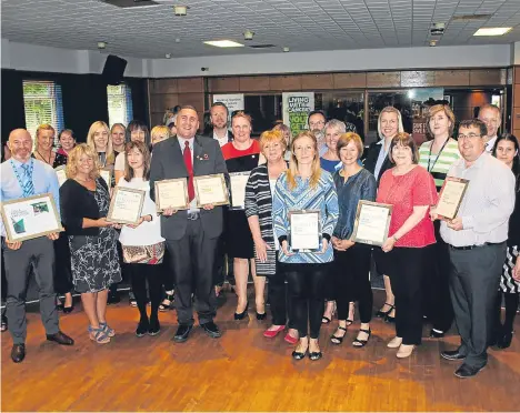  ??  ?? TAYSIDE organisati­ons were the stars of a special ceremony to celebrate their efforts in building healthy workplaces for staff.
A range of awards were handed out to businesses and organisati­ons at an event to celebrate achievemen­t in NHS Tayside’s...