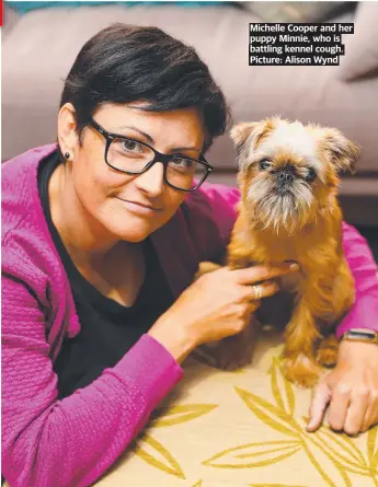  ?? ?? Michelle Cooper and her puppy Minnie, who is battling kennel cough. Picture: Alison Wynd