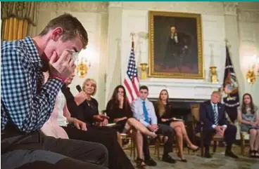  ?? EPA PIC ?? Marjory Stoneman Douglas High School shooting survivor Samuel Zeif (left) crying after delivering remarks as President Donald Trump listens during a listening session at the White House in Washington, DC, on Wednesday.