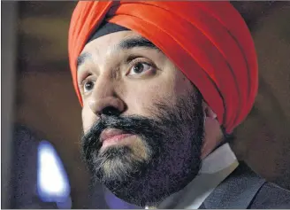  ?? CP PHOTO ?? Minister of Innovation, Science and Economic Developmen­t Navdeep Bains listens to a question during a press conference on Parliament Hill in Ottawa last year.
