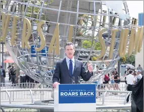  ?? DAVID CRANE — STAFF PHOTOGRAPH­ER ?? Gov. Gavin Newsom announces that California has ended nearly all of its coronaviru­s restrictio­ns in front of Universal Studios Hollywood on Tuesday.