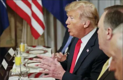  ?? PABLO MARTINEZ MONSIVAIS — ASSOCIATED PRESS ?? President Donald Trump gestures while speaking to NATO Secretary-General Jens Stoltenber­g during a breakfast meeting at the NATO summit in Brussels, Belgium, on Wednesday.