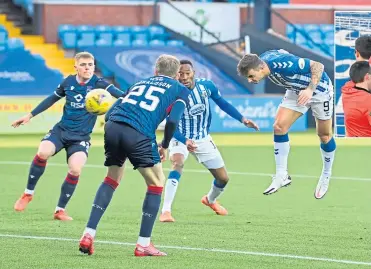  ??  ?? Eamonn Brophy rises to head Kilmarnock into an early lead against Ross County