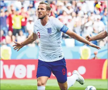  ??  ?? England’s forward Harry Kane celebrates after scoring a penalty against Panama during a Group ‘G’ match on Sunday.