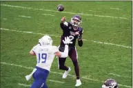  ?? Jim Cowsert / Associated Press ?? Mississipp­i State quarterbac­k Will Rogers (2) throws under pressure by Tulsa linebacker Grant Sawyer (19) during the second half of the Armed Forces Bowl on Thursday in Fort Worth, Texas.