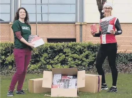  ??  ?? Kathryn Forte, right, presents gifts to Ciara Barrett Smith from Wearside Women in Need.