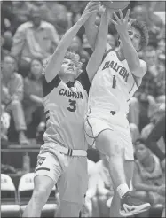  ?? Barbara Hall ?? Calhoun junior forward Jace Johns battles a Dalton player for a rebound during the Yellow Jackets’ regular season finale last Friday night against the Catamounts. Dalton won the game, 57-49 to clinch a first-round bye in this week’s Region 7-5A tournament in Cartersvil­le.