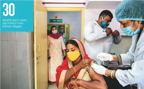  ?? The New York Times ?? A health worker administer­s a Covid-19 vaccine in Dotai. In the absence of blanket vaccinatio­ns, Uttar Pradesh, like the rest of India, is left to hope that any third wave of infections is not a repeat of the second.