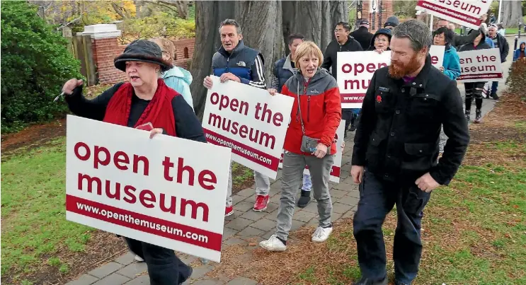  ?? PHOTOS: JOHN HAWKINS/STUFF ?? Cherie Chapman leads the Museum Funeral protesters towards the Museum in the rain yesterday afternoon.